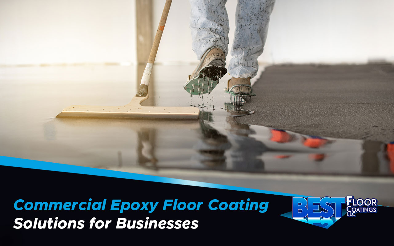 Technician applying epoxy coating in a commercial space